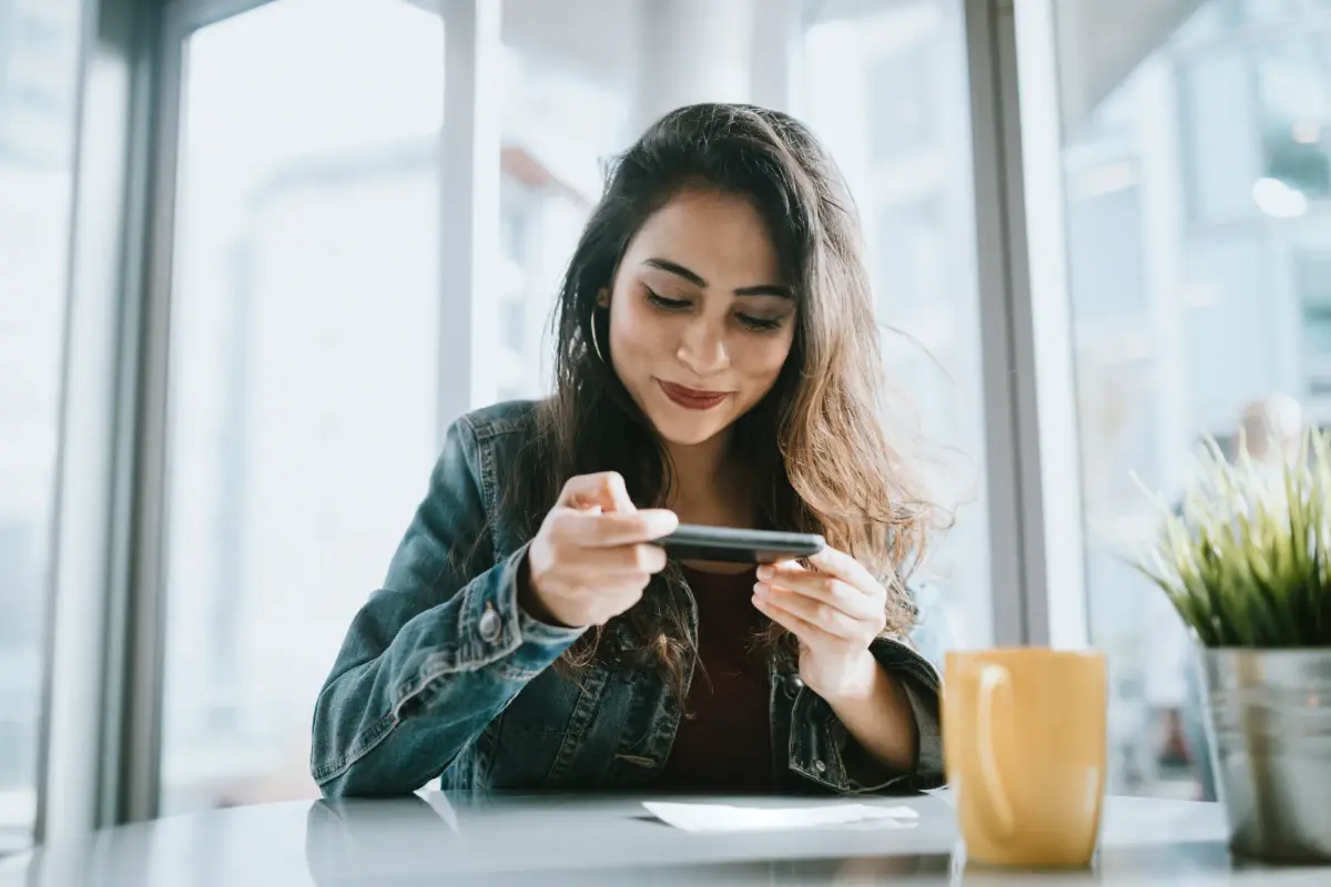 woman-using-smartphone-for-mobile-check-deposit-1200x800
