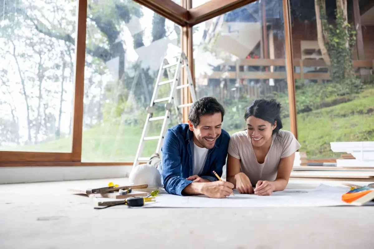 couple-planning-home-remodel-blueprints-1200-800
