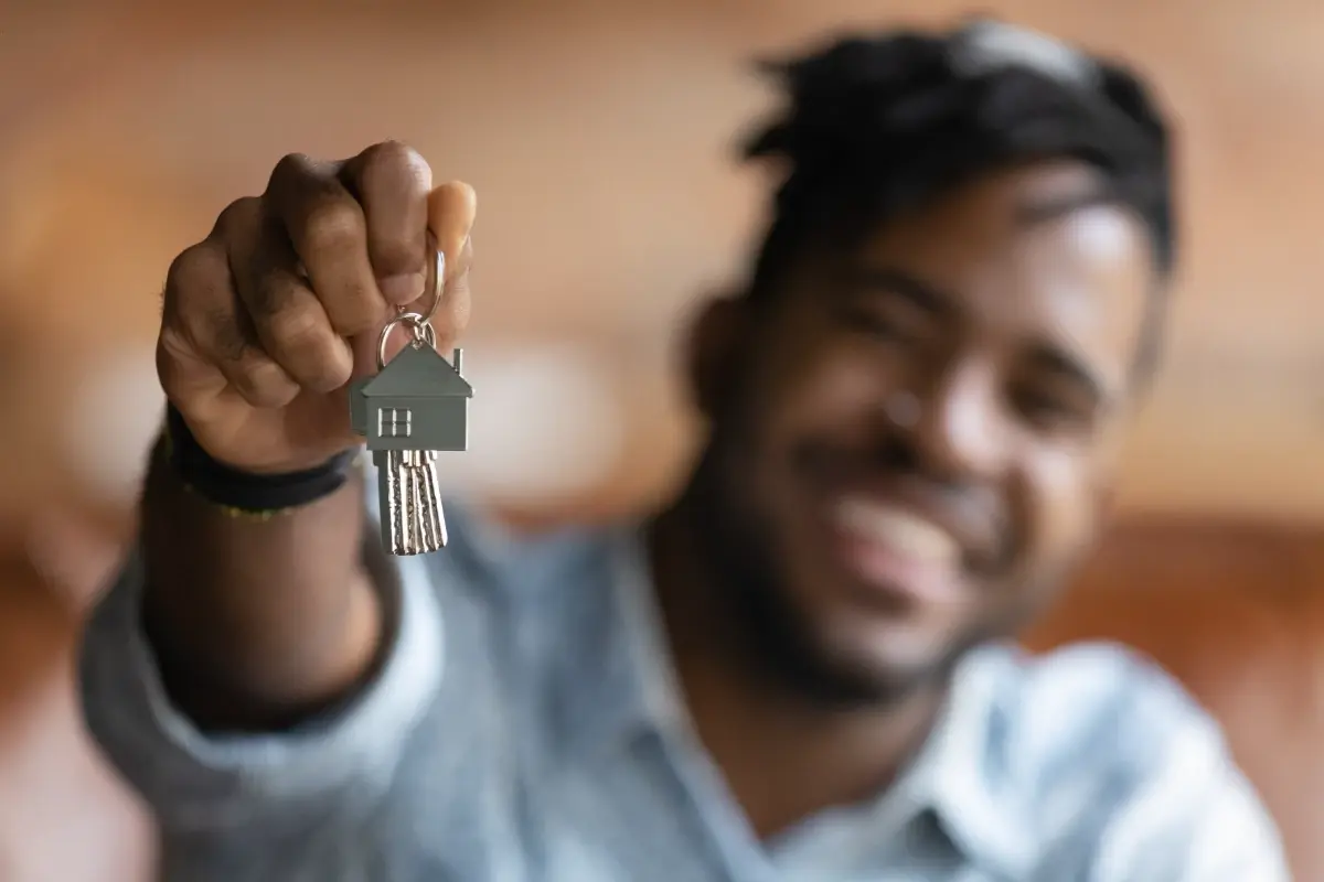 happy-homeowner-holding-house-keys-1200x800